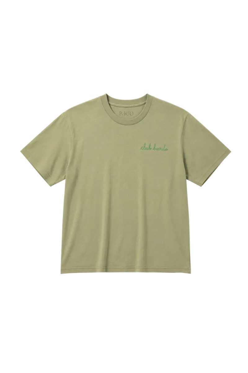 An olive green crewneck t-shirt with a small green script logo on the left chest, displayed flat against a light gray background.