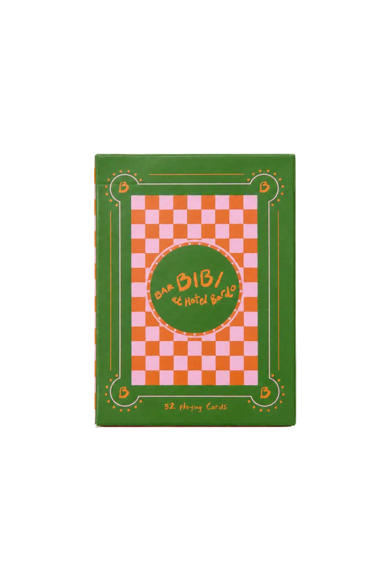 A green hardcover notebook or journal featuring a pink and white checkered pattern in the center, with a green oval label that reads 'SAN BIBI / 14 HOLIDAYS' in orange. The cover has a decorative border and small text at the bottom reading 'SP.