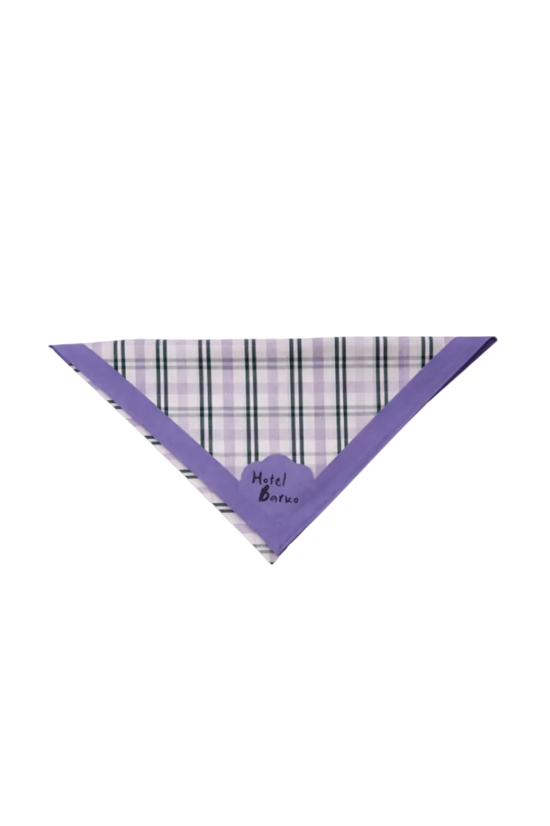 A triangular pet bandana with a purple border and a purple, white, and black plaid pattern, featuring the brand name 'Hotel Barko' printed in black script on the front.